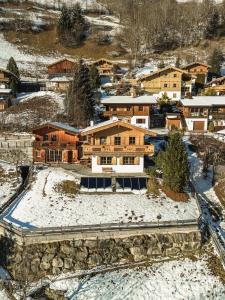 an aerial view of a house in the snow at Chalet Obenland Panorama Aussicht Kitzbühler Alpen in Bramberg am Wildkogel