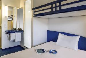 Postel nebo postele na pokoji v ubytování ibis budget Aachen Raeren Grenze
