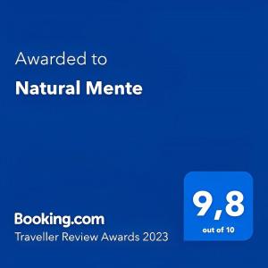 a blue sign with the words awarded to natural matteline with a screenshot at Natural Mente in Pompei