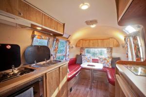 a kitchen and living room of an rv at The Airstream in Penryn