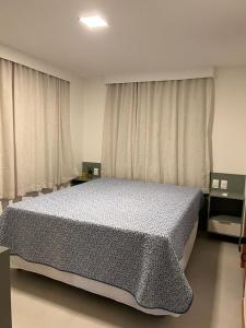 Giường trong phòng chung tại Casa Califórnia
