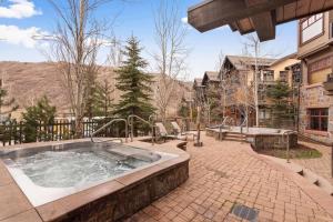 a large hot tub in a patio with at Capitol Peak 3518 in Snowmass Village