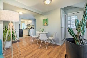 a kitchen and living room with a table and chairs at Charming Warwick Vacation Rental Walk to Bay in Warwick