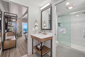 a bathroom with a sink and a shower at Shoreline Inn...on the beach in Cayucos