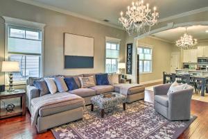 a living room with a couch and a table at Chic Thomas Square Home in Walkable Location! in Savannah