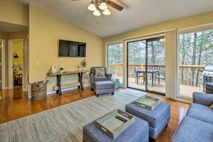 a living room with furniture and a balcony at Cozy Table Rock Lake Vacation Rental with Deck in Golden
