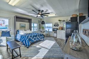 a bedroom with a bed and a kitchen at Waterfront Tarpon Springs Vacation Rental! in Tarpon Springs