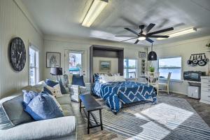 a bedroom with a bed and a couch at Waterfront Tarpon Springs Vacation Rental! in Tarpon Springs