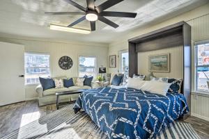 a bedroom with a bed and a ceiling fan at Waterfront Tarpon Springs Vacation Rental! in Tarpon Springs