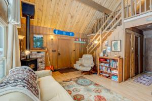 a living room with a couch and a fireplace at Lofty Lodi in South Lake Tahoe