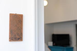 a door with a sign that reads return home at La Bella Annacapri in Anacapri