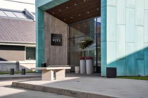 a building with a bench in front of it at Best Western Plus Hotel Fredericia in Fredericia