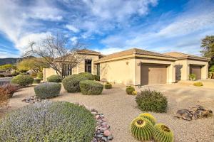 a house with a lot of plants in front of it at Pet-Friendly Scottsdale Vacation Home with Patio in Scottsdale