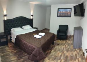 Postel nebo postele na pokoji v ubytování RONALD HOTEL