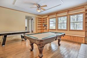 a room with a pool table and a ceiling fan at Large Greeley House with 2 Game Rooms and Yard! in Lackawaxen