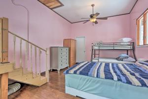 a bedroom with a bunk bed and a staircase at Large Greeley House with 2 Game Rooms and Yard! in Lackawaxen