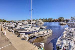 a bunch of boats are docked in a marina at Updated Barefoot Resort Condo On-Site Golf! in North Myrtle Beach