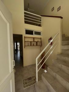 a staircase in a house with a stair case at Departamento Kuyen in Las Grutas