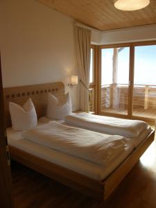 A bed or beds in a room at Apartments Karlhof