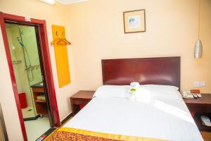 Cama o camas de una habitación en Meiyuan Hotel
