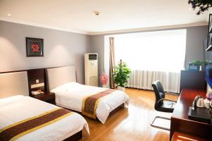 Postel nebo postele na pokoji v ubytování Meiyuan Hotel + 25 fotografií