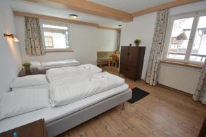 Llit o llits en una habitació de Haus Irmgard by Châtel Reizen