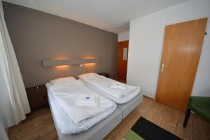 Llit o llits en una habitació de Haus Irmgard by Châtel Reizen