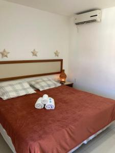 Postel nebo postele na pokoji v ubytování Eco Paradise Cumbuco pé na areia 202