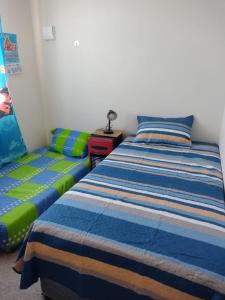 a bedroom with a bed and a couch at La serena, Brisas Del Valle in La Serena