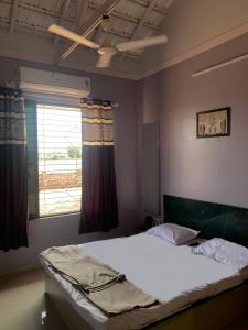 Postel nebo postele na pokoji v ubytování Your dream vacation @ Sudhashree