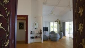 a living room with blue spheres in the middle of the room at Baan Zourite seaview villa in Ko Mak