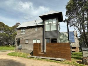 a house with a roof on top of it at Meltdown, alpine-getaways in Dinner Plain