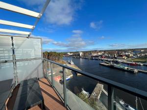 a view of a river from the balcony of a building at Lighthouse Luxury Penthouse - Jantar Apartamenty in Mrzeżyno