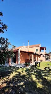 a house with a picnic table in front of it at Lonelia's Family Homes in Lefkímmi +37 photos