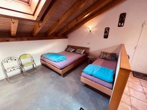 Rúm í herbergi á Gîte la Cigale
