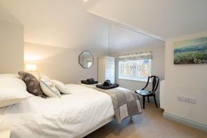 Postel nebo postele na pokoji v ubytování Gulls Roost, Port Isaac Bay Holidays