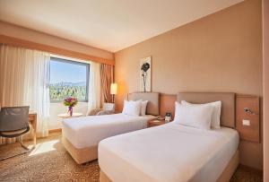 A bed or beds in a room at Park Dedeman Denizli