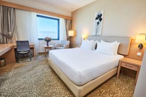 A bed or beds in a room at Park Dedeman Denizli