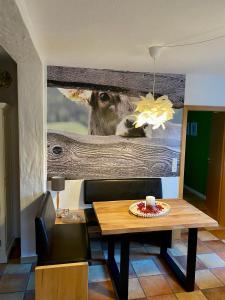 a painting of a deer on a wall in a living room at Casa-Catalina in Heddesheim