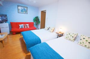 Postel nebo postele na pokoji v ubytování HOTEL AARON通天西