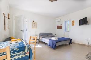 Ein Bett oder Betten in einem Zimmer der Unterkunft Villa Spigolizzi - vista mare
