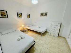 A bed or beds in a room at A2 - Calasol - 2004 Finestrat