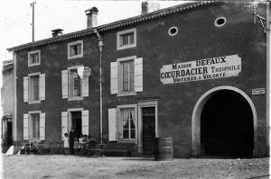 a black and white photo of a building at Maison entière avec petite cour intérieure. in Monthureux-sur-Saône