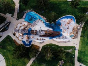 an aerial view of a water park with a water slide at Seashells Bayside Retreat in Busselton