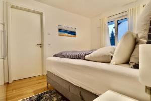 a bedroom with a large bed and a window at Modern Apartment, central in Bad Aibling in Bad Aibling