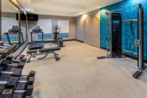 a gym with treadmills and exercise equipment in a room at La Quinta by Wyndham Bridgeport in Bridgeport