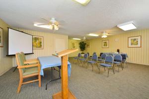 a conference room with chairs and a white board at Travelodge by Wyndham Palm Springs in Palm Springs