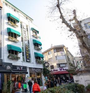 a group of people walking in front of a building at Grand Luxury in Yalova