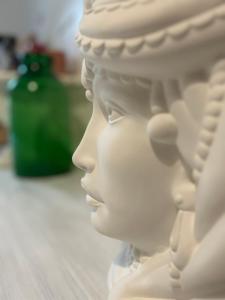 a close up of a white head on a table at Casa Pinù in San Michele di Ganzaria