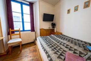 Un pat sau paturi într-o cameră la Red Point